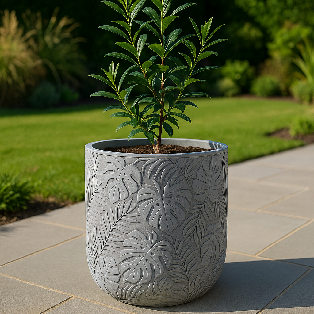 Potted plant in a decorative gray pot on a patio with a garden background